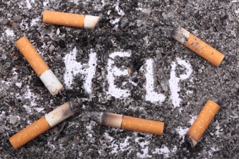 help sign with cigarette butts on the floor