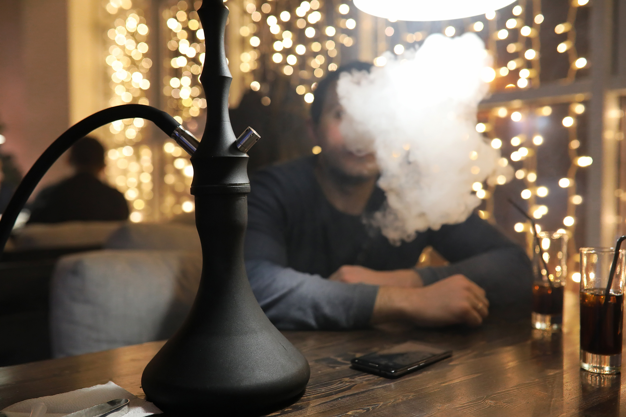 hookah pipe surrounded by a cloud of smoke