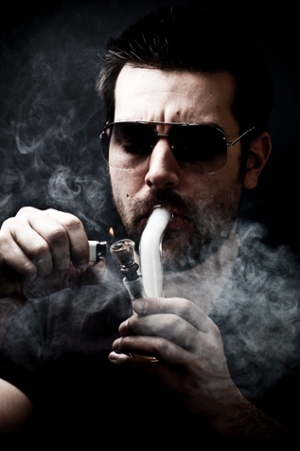 man smoking a bong