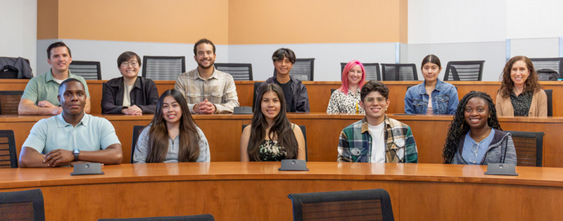 12 students sitting in a classroom 